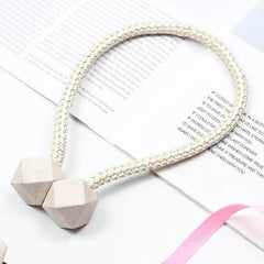 Non-magnetic curtain tiebacks with decorative pearls